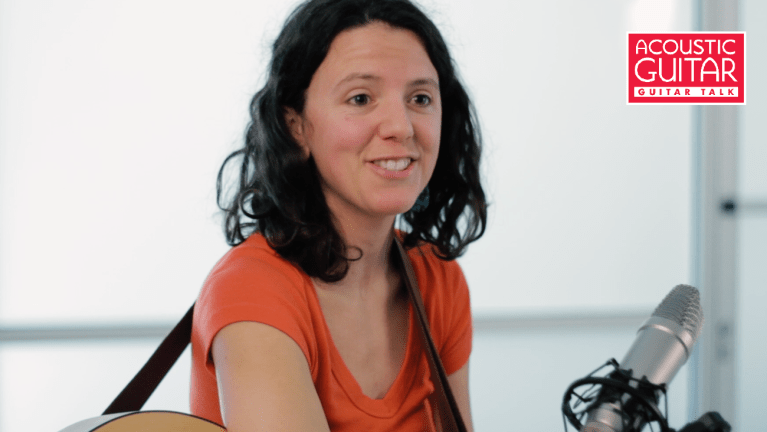 Mandy Fer with her acoustic guitar.
